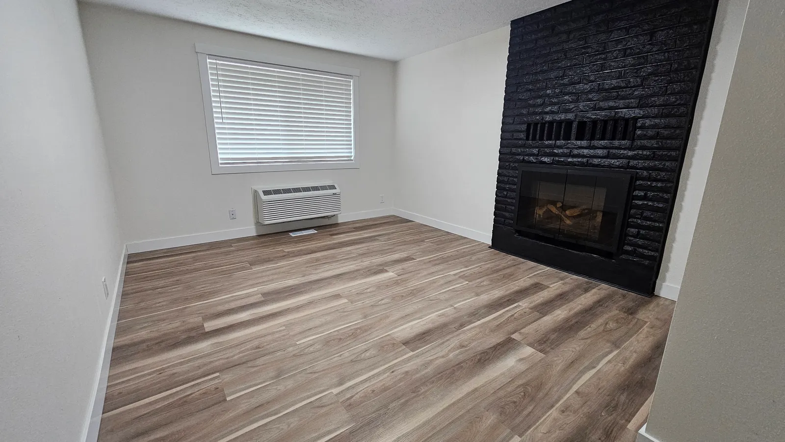 Private room 4 with fireplace at Blue Mountain Residential Care Home in Oregon City, empty
